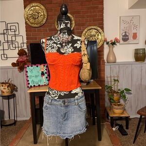 Out from under Bright Orange Corset Top